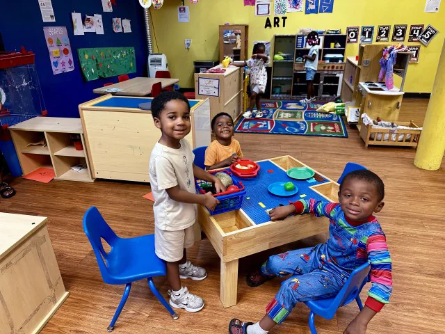Children learning and playing together in a North Wales Academy classroom